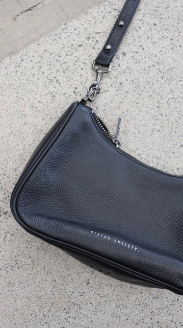 STATUS ANXIETY. handbag N/A