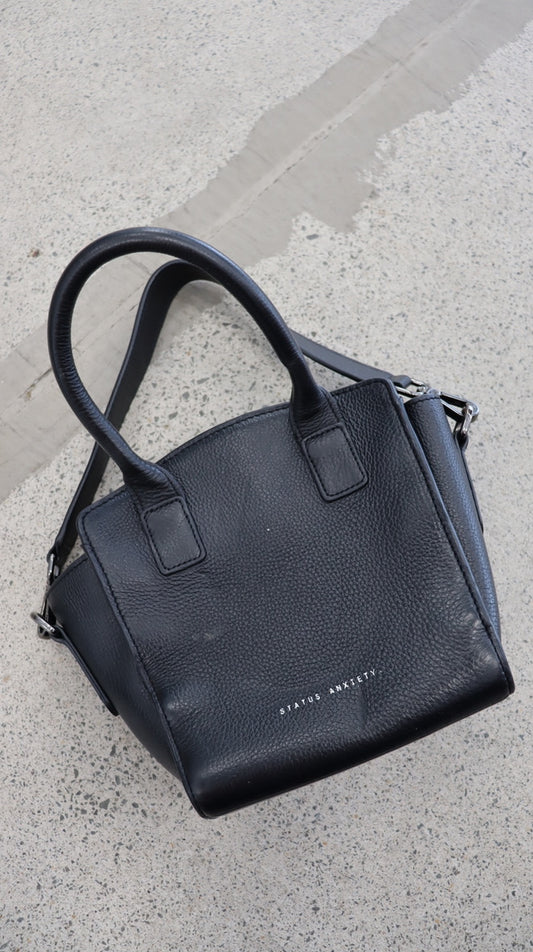 STATUS ANXIETY. handbag N/A
